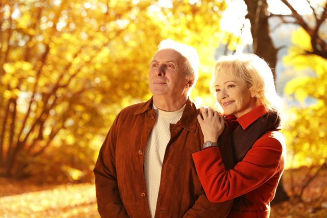 Lovely mature couple in autumn park