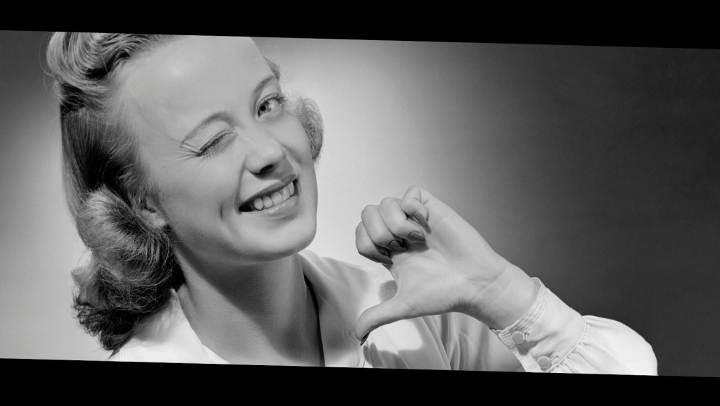 Woman winks at the viewer