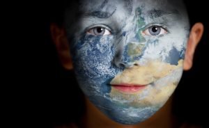 Boy with Earth superimposed on face. We are nature!